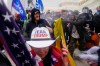 Trump supporters try to break through a police barrier, Wednesday, Jan. 6, 2021, at the Capitol in Washington. As Congress prepares to affirm President-elect Joe Biden's victory, thousands of people have gathered to show their support for President Donald Trump and his claims of election fraud.(AP Photo/John Minchillo)