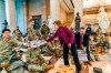 Rep. Vicky Hartzler, R-Mo., and Rep. Michael Waltz, R-Fla., hand pizzas to members of the National Guard gathered at the Capitol Visitor Center, Wednesday, Jan. 13, 2021, in Washington. as the House of Representatives continues with its fast-moving House vote to impeach President Donald Trump, a week after a mob of Trump supporters stormed the U.S. Capitol. (AP Photo/Manuel Balce Ceneta)