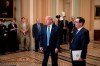 President Donald Trump, joined by Treasury Secretary Steven Mnuchin, right, speaks to reporters after meeting with Republican senators, on Capitol Hill in Washington, Tuesday, March 10, 2020. Trump wants Congress to pass payroll tax relief as he looks to calm financial markets' fears over the impact of the coronavirus epidemic. (AP Photo/J. Scott Applewhite)