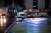 Emergency service vehicles and a bus of the airport fire brigade stand on the grounds of Hannover-Langenhagen Airport in Hannover, Germany, late Sunday, Dec. 20, 2020. Passengers arrived wit a plane from London have to stay at the airport until they have the results of COVID-19 test. Due to the new variant of the coronavirus, the German authorities have instructed that all travelers from Great Britain and South Africa be systematically screened on the coronavirus with immediate effect. (Moritz Frankenberg/dpa via AP)