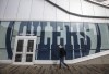 A pedestrian walks outside Rogers Place, home of the Edmonton Oilers, in Edmonton, Alta., on Thursday March 12, 2020. The NHL has suspended the 2019-20 season due to the COVID-19 pandemic. THE CANADIAN PRESS/Jason Franson