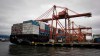 A container ship is unloaded at port in Vancouver, B.C., on Saturday December 23, 2012. THE CANADIAN PRESS/Darryl Dyck