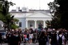 Demonstrators gather to protest the death of George Floyd, Tuesday, June 2, 2020, near the White House in Washington. Floyd died after being restrained by Minneapolis police officers. Moving among the pulsing mass of angry activism outside the White House, a handful of people are on hand to provide help and first aid to both police and protesters alike. THE CANADIAN PRESS/AP-Jacquelyn Martin