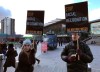 People demonstrate in front of a mobile police facial recognition facility outside a shopping centre in London on Feb. 2020. Dozens of groups and individuals working to protect privacy, human rights and civil liberties want the Trudeau government to ban the use of facial-recognition surveillance by federal law-enforcement and intelligence agencies. THE CANADIAN PRESS/AP-Kelvin Chan