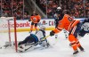 Winnipeg Jets goalie Connor Hellebuyck (37) is scored on by Edmonton Oilers' Connor McDavid (97) during second period NHL action in Edmonton, Alta., on Wednesday March 11, 2020.The NHL says it is evaluating its options for the rest of the 2019-20 season after the NBA suspended its season until further notice on Wednesday night. THE CANADIAN PRESS/Jason Franson