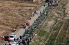 Bodies of the victims of a Ukrainian plane crash are collected by rescue team at the scene of the crash in Shahedshahr, southwest of the capital Tehran, Iran, Wednesday, Jan. 8, 2020. A Ukrainian passenger jet carrying 176 people crashed on Wednesday, just minutes after taking off from the Iranian capital's main airport, turning farmland on the outskirts of Tehran into fields of flaming debris and killing all on board. (AP Photo/Ebrahim Noroozi)