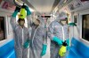 Workers disinfect subway trains against coronavirus in Tehran, Iran, in the early morning of Wednesday, Feb. 26, 2020. Iran's government said Tuesday that more than a dozen people had died nationwide from the new coronavirus, rejecting claims of a much higher death toll of 50 by a lawmaker from the city of Qom that has been at the epicenter of the virus in the country. (AP Photo/Ebrahim Noroozi)