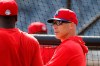 Philadelphia Phillies manager Joe Girardi talks to shortstop Didi Gregorius during pregame of a spring training baseball game, Wednesday, March 4, 2020, in Clearwater, Fla. (AP Photo/Carlos Osorio)