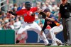 Boston Red Sox's Jackie Bradley Jr. gets back to first safely on a pickoff attempt to Houston Astros first baseman Nick Tanielu during a spring training baseball game, Thursday, March 5, 2020, in Fort Myers, Fla. (AP Photo/Elise Amendola)