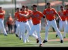 Baltimore Orioles starting pitcher Alex Cobb (17) and relief pitcher Shawn Armstrong (43) and other pitchers warm up during spring training baseball, Saturday, Feb. 15, 2020, in Sarasota, Fla. (AP Photo/John Bazemore)