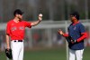 Boston Red Sox starting pitcher Chris Sale, left, talks with Pedro Martinez during spring training baseball camp Wednesday, Feb. 19, 2020, in Sarasota, Fla. (AP Photo/John Bazemore)