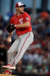 Washington Nationals starting pitcher Max Scherzer (31) works in the first inning of a spring training baseball game against the Houston Astros Saturday, Feb. 22, 2020, in West Palm Beach, Fla. (AP Photo/John Bazemore)