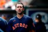 Houston Astros pitcher Justin Verlander walks in the dugout after pitching to the St. Louis Cardinals in the first inning of a spring training baseball game, Tuesday, March 3, 2020, in Jupiter, Fla. (AP Photo/Julio Cortez)