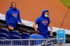 New York Mets players walks to the dugout before a baseball game against the Miami Marlins, Thursday, Aug. 20, 2020, in Miami. Major League Baseball says the Mets have received two positive tests for COVID-19 in their organization, prompting the postponement of two games. (AP Photo/Lynne Sladky)