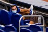 New York Mets right fielder Michael Conforto sits in the stands before a baseball game against the Miami Marlins, Thursday, Aug. 20, 2020, in Miami. Major League Baseball says the Mets have received two positive tests for COVID-19 in their organization, prompting the postponement of two games against the Marlins. (AP Photo/Lynne Sladky)