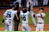 Miami Marlins' Garrett Cooper (26), Jazz Chisholm (70) and Corey Dickerson, right, celebrate after they scored on a double by Starling Marte during the eighth inning of a baseball game against the Philadelphia Phillies, Thursday, Sept. 10, 2020, in Miami. (AP Photo/Wilfredo Lee)
