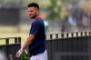 Houston Astros infielder Jose Altuve puts on batting gloves during spring training baseball practice Thursday, Feb. 13, 2020, in West Palm Beach, Fla. (AP Photo/Jeff Roberson)
