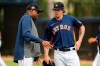 Houston Astros manager Dusty Baker, left, talks with pitcher Chris Devenski during spring training baseball practice Thursday, Feb. 13, 2020, in West Palm Beach, Fla. (AP Photo/Jeff Roberson)