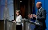 European Commission President Ursula von der Leyen, left, listens to European Council President Charles Michel during a joint news conference at the end of a EU summit video conference at the European Council headquarters in Brussels, Thursday, Jan. 21, 2021. European Union leaders assessed more measures to counter the spread of coronavirus variants during a video summit Thursday as the bloc's top disease control official said urgent action was needed to stave off a new wave of hospitalizations and deaths. (Olivier Hoslet, Pool Photo via AP)