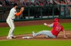 Los Angeles Angels' Mike Trout, right, slides into third on his triple next to San Francisco Giants third baseman Evan Longoria during the seventh inning of a baseball game in San Francisco, Thursday, Aug. 20, 2020. (AP Photo/Jeff Chiu)