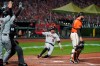 Arizona Diamondbacks' Josh Rojas (10) slides into home plate to score in the fourth inning of a baseball game against the San Francisco Giants, Friday, Sept. 4, 2020, in San Francisco. Rojas scored after the Diamondbacks' Daulton Varsho singled to deep right field. Giants catcher Joey Bart, right, looks on. (AP Photo/Eric Risberg)