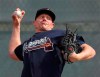 Atlanta Braves pitcher Mark Melancon throws at baseball spring training camp in North Port, Fla., Friday, Feb. 14, 2020. (Curtis Compton/Atlanta Journal-Constitution via AP)