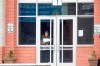 A student waits at the front entrance at Woodland Middle School in East Point, Ga.,Monday, March 9, 2020. The Fulton County School system has decided to close schools on Tuesday after a teacher tested positive with the coronavirus. The teacher was at Woodland Middle school on Friday. (Alyssa Pointer/Atlanta Journal-Constitution via AP)