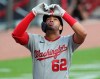 Washington Nationals' Luis Garcia reacts after hitting a two-run home run against the Atlanta Braves during the second inning of a baseball game on Monday, Aug. 17, 2020, in Atlanta. (Curtis Compton/Atlanta Journal-Constitution via AP)