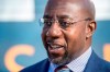 Georgia Democratic senate candidate Raphael Warnock talks to reporters following a campaign rally in Augusta, Ga., Monday, Jan. 4, 2021. Democrats Jon Ossoff and Warnock are challenging incumbent Republican Senators David Perdue and Kelly Loeffler in a runoff election on Jan. 5. (Michael Holahan/The Augusta Chronicle via AP)