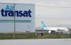 Air Transat says it is cancelling all flights from Western Canada to sunshine destinations or the United States this winter, with refunds en route to customers. An Air Transat plane is seen as an Air Canada plane lands at Pierre Elliott Trudeau International Airport in Montreal on Thursday, May 16, 2019. THE CANADIAN PRESS/Ryan Remiorz