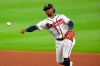 Atlanta Braves second baseman Ozzie Albies Tampa Bay Rays' Joey Wendle at first base during the sixth inning of a baseball game Thursday, July 30, 2020 in Atlanta. (AP Photo/John Amis)