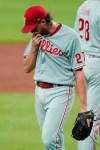 Philadelphia Phillies starting pitcher Aaron Nola leaves the mound after being replaced in the third inning of a baseball game against the Atlanta Braves Friday, Aug. 21, 2020, in Atlanta. (AP Photo/John Bazemore)