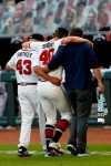 Atlanta Braves starting pitcher Mike Soroka (40) is helped off the field by manager Brian Snitker (43) and a trainer after being injured in the third inning of a baseball game against the New York Mets Monday, Aug. 3, 2020, in Atlanta. (AP Photo/John Bazemore)
