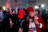 Two women pray during a Republican election-night watch party, Tuesday, Jan. 5, 2021, in Atlanta. (AP Photo/John Bazemore)