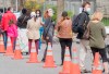 People wait to be tested for COVID-19 at a mobile clinic in Montreal, Sunday, May 17, 2020, as the COVID-19 pandemic continues in Canada and around the world. THE CANADIAN PRESS/Graham Hughes