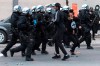 Police push back protesters during a demonstration calling for justice in the death of George Floyd and victims of police brutality in Montreal, Sunday, May 31, 2020.THE CANADIAN PRESS/Graham Hughes