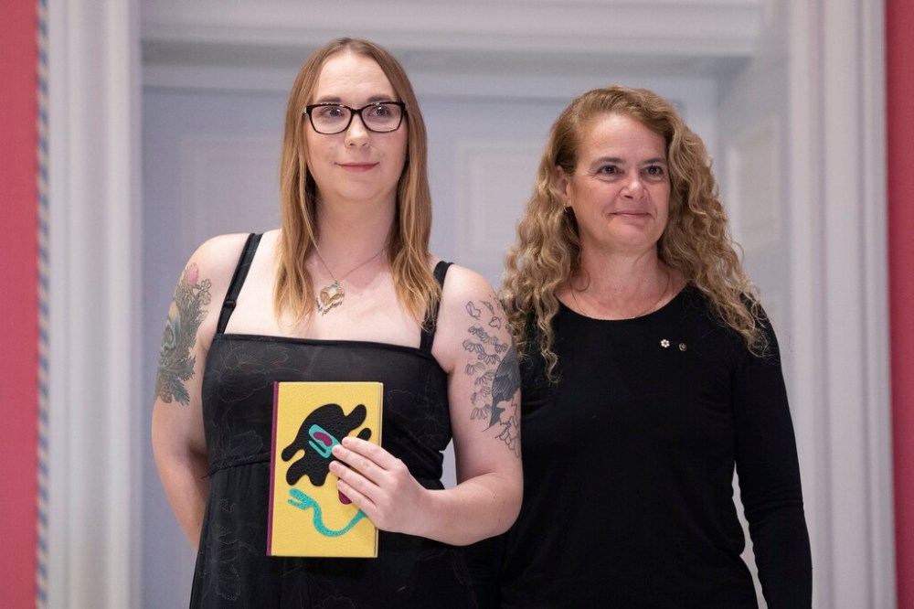 Gwen Benaway (left) receives a Governor General's Literary Award for Poetry for her work Holy Wild from Gov. Gen. Julie Payette in December. Benaway claimed to be Indigenous, then shut down her Twitter account when asked for proof. (Chris Wattie / The Canadian Press files)