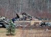 An RCMP investigator inspects a house destroyed by fire at the residence of Alanna Jenkins and Sean McLeod, both corrections officers, in Wentworth Centre, N.S. on Monday, April 20, 2020. A neighbour, Tom Bagley, was also killed on the property. Police say at least 19 people are dead, including RCMP Const. Heidi Stevenson, after a man, driving a restored police car, went on a murder spree in several Nova Scotia communities. THE CANADIAN PRESS/Andrew Vaughan