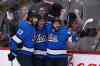 From left, Winnipeg Jets' Adam Lowry (17), Jack Roslovic (28) and Mathieu Perreault (85) celebrates Roslovic's goal during first period NHL action against the Vancouver Canucks. (Fred Greenslade / Canadian Press)