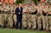 FILE - In this Thursday, March 30, 2017 file photo, Britain's Prince Philip, in his capacity of Colonel, Grenadier Guards, talks with members of the 1st Battalion Grenadier Guards as they applaud the final whistle from the sidelines, of the Manchester Cup inter-company football match at Lille Barracks in Aldershot, England. Buckingham Palace officials say Prince Philip, the husband of Queen Elizabeth II, has died, it was announced on Friday, April 9, 2021. He was 99. Philip spent a month in hospital earlier this year before being released on March 16 to return to Windsor Castle. Philip, also known as the Duke of Edinburgh, married Elizabeth in 1947 and was the longest-serving consort in British history. (AP Photo/Matt Dunham, Pool, File)