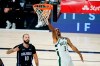 Milwaukee Bucks' George Hill (3) drives to the basket past Orlando Magic's Evan Fournier (10) during the second half of an NBA basketball first round playoff game Monday, Aug. 24, 2020, in Lake Buena Vista, Fla. (AP Photo/Ashley Landis, Pool)