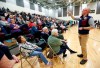 Christopher Le Mon, right, a precinct captain for former Vice President Joe Biden, counts supporters during the Democratic caucus at Hempstead High School in Dubuque, Iowa, on Monday, Feb. 3, 2020. (Nicki Kohl/Telegraph Herald via AP)