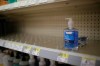 FILE - In this Feb. 28, 2020 file photo, rows of hand sanitizer are seen empty at a Walgreens in Idaho Falls, Idaho. Fear of the coronavirus has led people to stock up on hand sanitizer, leaving store shelves empty and online retailers with sky-high prices set by those trying to profit on the rush. (John Roark/The Idaho Post-Register via AP, file)