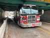 The truck is currently stopped under the Midtown Bridge; the bridge is open but Assiniboine Avenue underneath it is closed in both directions between Hargrave and Navy Way. (Danielle DaSilva / Winnipeg Free Press)