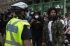 Demonstrators take part in a rally protesting the death of Regis Korchinski-Paquet in downtown Toronto on May 30, 2020. The death of a Toronto woman who fell from her 24th-floor balcony while police were in her home has renewed calls for an overhaul of how society deals with people in mental health crises. THE CANADIAN PRESS/Chris Young