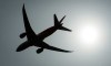 A plane is silhouetted as it takes off from Vancouver International Airport in Richmond, B.C., on May 13, 2019. THE CANADIAN PRESS/Jonathan Hayward