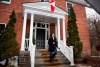 Prime Minister Justin Trudeau looks up at the falling rain as he arrives for his daily press conference on COVID-19 in front of his residence at Rideau Cottage, on the grounds of Rideau Hall in Ottawa, on Sunday, March 29, 2020. THE CANADIAN PRESS/Justin Tang