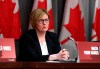 Minister of Employment, Workforce Development and Disability Inclusion Carla Qualtrough listens during a press conference on COVID-19 at West Block on Parliament Hill in Ottawa, on Wednesday, March 25, 2020. THE CANADIAN PRESS/Justin Tang