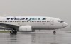 A WestJet airlines plane at the Ottawa airport Wednesday June 26, 2019. WestJet Airlines Ltd. says it will end its seat distancing policy on board starting July 1. THE CANADIAN PRESS/Adrian Wyld