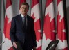 Bank of Canada Governor designate Tiff Macklem takes his seat for a news conference Friday May 1, 2020 in Ottawa. Canada's new top central banker says the Bank of Canada has no intention to raise interest rates given the current economic circumstances created by the COVID-19 pandemic. THE CANADIAN PRESS/Adrian Wyld